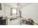 Bedroom with gym equipment, natural light from the window, and neutral carpeting at 1324 N Stewart Rd, Anderson, IN 46012