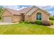 Beautiful brick home with a well-manicured lawn, featuring a blend of classic design and modern appeal at 1324 N Stewart Rd, Anderson, IN 46012