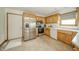 Well-lit kitchen featuring wooden cabinets, stainless steel appliances, and light countertops at 1324 N Stewart Rd, Anderson, IN 46012