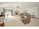Bright living room with comfortable seating, a vaulted ceiling, a fireplace, and large windows with natural light at 1324 N Stewart Rd, Anderson, IN 46012
