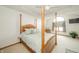 Spacious main bedroom featuring a four-poster bed, a ceiling fan, and ample natural light at 1324 N Stewart Rd, Anderson, IN 46012