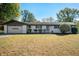Charming single-story home featuring a two-car garage and a well-maintained front yard at 1325 Alimingo Dr, Indianapolis, IN 46260