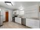 Bright kitchen featuring stainless steel appliances, white cabinets, and ample counter space at 1325 Alimingo Dr, Indianapolis, IN 46260