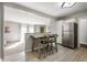 Open kitchen with stainless steel appliances and a stylish breakfast bar at 1325 Alimingo Dr, Indianapolis, IN 46260