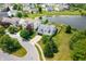 Aerial view of the home with its well-manicured lawn, and beautiful landscaping in a lakeside community at 1412 Huntzinger Blvd, Pendleton, IN 46064