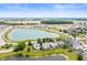 Aerial view showcases this idyllic community surrounding a pristine lake with manicured green spaces at 1412 Huntzinger Blvd, Pendleton, IN 46064