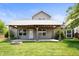 Charming home's backyard features a covered patio and an inviting fire pit area at 1412 Huntzinger Blvd, Pendleton, IN 46064