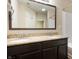 Bathroom featuring a double vanity, granite countertop, and a framed mirror at 1412 Huntzinger Blvd, Pendleton, IN 46064