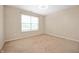 Bright and airy bedroom featuring neutral carpet and a large window for natural light at 1412 Huntzinger Blvd, Pendleton, IN 46064