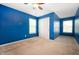 Bedroom features neutral carpet, multiple windows, and a closet for storage at 1412 Huntzinger Blvd, Pendleton, IN 46064