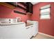 Well-organized laundry room with updated appliances, cabinets, and counter space at 1412 Huntzinger Blvd, Pendleton, IN 46064