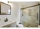 Modern bathroom featuring sleek vanity, toilet, and shower with glass doors and tile surround at 1506 Bowman Dr, Greenfield, IN 46140
