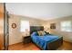 Bright bedroom featuring a comfortable queen-size bed with blue quilt, and ample natural light at 1506 Bowman Dr, Greenfield, IN 46140