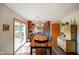 Bright dining room featuring modern lighting and an adjacent kitchen, perfect for entertaining at 1506 Bowman Dr, Greenfield, IN 46140