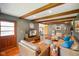 Cozy living room with wood floors, exposed wood beams, and comfortable seating arrangement at 1506 Bowman Dr, Greenfield, IN 46140