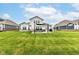 Large backyard featuring lush lawn and a welcoming patio area for outdoor enjoyment at 15097 Thoroughbred Dr, Fishers, IN 46040