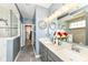 Stylish bathroom with double vanity, decorative mirrors, and open access to the walk-in closet at 15097 Thoroughbred Dr, Fishers, IN 46040