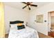 Bright bedroom with neutral walls, complemented by ceiling fan and stylish furnishings at 15097 Thoroughbred Dr, Fishers, IN 46040