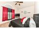 Cozy bedroom featuring large window, a ceiling fan, and comfortable sleeping arrangements at 15097 Thoroughbred Dr, Fishers, IN 46040
