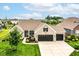 Beautiful single-Gathering home with a three-car garage, manicured lawn, and professional landscaping at 15097 Thoroughbred Dr, Fishers, IN 46040