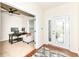 Bright home office with a large window, French door, and a neutral color scheme at 15097 Thoroughbred Dr, Fishers, IN 46040
