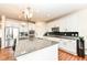 Gourmet kitchen features granite countertops, stainless appliances, and ample cabinet space at 15097 Thoroughbred Dr, Fishers, IN 46040