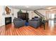 Inviting living room boasts a fireplace, hardwood floors, and an open layout at 15097 Thoroughbred Dr, Fishers, IN 46040