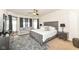 Spacious main bedroom with sitting area, plush carpet, and large windows at 15097 Thoroughbred Dr, Fishers, IN 46040