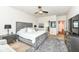 Comfortable main bedroom features a large bed, soft rug, and access to ensuite bathroom at 15097 Thoroughbred Dr, Fishers, IN 46040