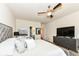 Inviting main bedroom with contemporary decor, TV, and access to ensuite bathroom at 15097 Thoroughbred Dr, Fishers, IN 46040