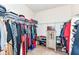Spacious walk-in closet with shelving and ample hanging space for clothes and shoe storage at 15097 Thoroughbred Dr, Fishers, IN 46040