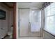 Bright bathroom featuring a glass enclosed shower and window with natural light at 17916 Racebrook Ct, Noblesville, IN 46062