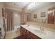 Bathroom with double sink vanity, bath tub, and a large mirror at 17916 Racebrook Ct, Noblesville, IN 46062