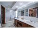 Spacious bathroom with double sinks, a glass-enclosed shower, and a large mirror at 17916 Racebrook Ct, Noblesville, IN 46062