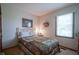 Bedroom with a comfortable bed, a lamp, and natural light from the window at 17916 Racebrook Ct, Noblesville, IN 46062