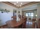 Open dining room connected to the living room featuring hardwood floors and traditional decor at 17916 Racebrook Ct, Noblesville, IN 46062