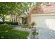 Inviting brick and siding home with a charming front porch and well-kept landscaping at 17916 Racebrook Ct, Noblesville, IN 46062