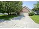Charming brick home featuring a two-car garage, mature trees, and a well-manicured lawn at 17916 Racebrook Ct, Noblesville, IN 46062