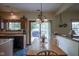 Eat-in kitchen offers sliding glass door to the patio and an overhead light fixture at 17916 Racebrook Ct, Noblesville, IN 46062