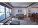 Cozy living room featuring neutral carpet, a large window, and comfortable seating at 17916 Racebrook Ct, Noblesville, IN 46062