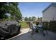 Cozy patio space with outdoor furniture and a grill, ideal for relaxation and entertaining in a private backyard setting at 17916 Racebrook Ct, Noblesville, IN 46062