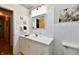 Well-lit bathroom featuring a white vanity, decorative mirror, and stylish accents at 1910 Ivy Dr, Anderson, IN 46011
