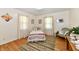 Charming bedroom with hardwood floors, natural light and cozy decor at 1910 Ivy Dr, Anderson, IN 46011