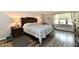 Comfortable bedroom featuring a large bed, bedside tables, and a window at 1910 Ivy Dr, Anderson, IN 46011
