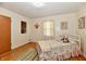 Bedroom with hardwood floors, natural light, and a comfy twin bed at 1910 Ivy Dr, Anderson, IN 46011