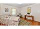 Bright bedroom with hardwood floors, decor and featuring a comfortable twin bed at 1910 Ivy Dr, Anderson, IN 46011
