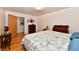 Comfortable bedroom featuring hardwood floors, classic furniture, and a calming ambiance at 1910 Ivy Dr, Anderson, IN 46011
