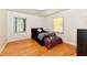 Bedroom features hardwood floors, and two windows for natural light at 1910 Ivy Dr, Anderson, IN 46011