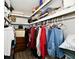 Walk-in closet with shelving, hanging rods, and organized storage solutions for clothing and accessories at 1910 Ivy Dr, Anderson, IN 46011