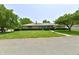 Charming one-story brick home with manicured lawn and mature trees, offering great curb appeal at 1910 Ivy Dr, Anderson, IN 46011